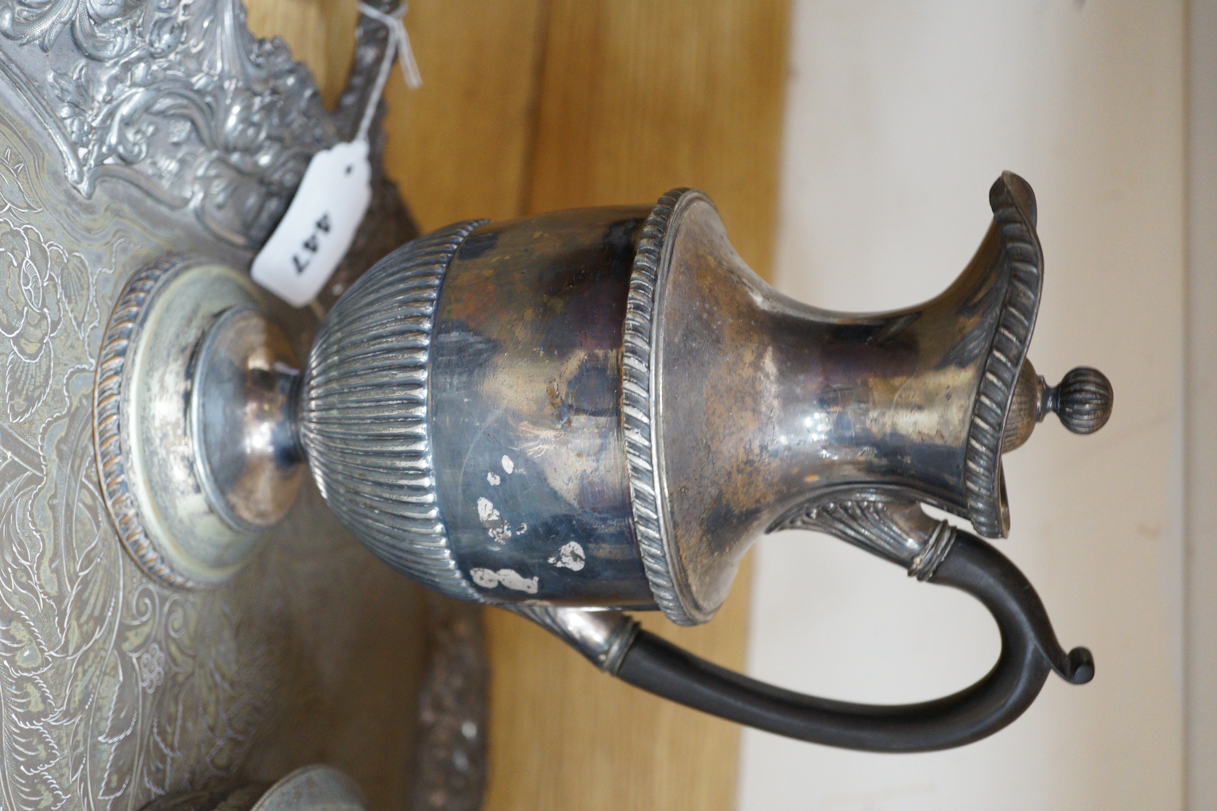 A silver plated two handled tea tray and seven other plated items, tray length 80cm